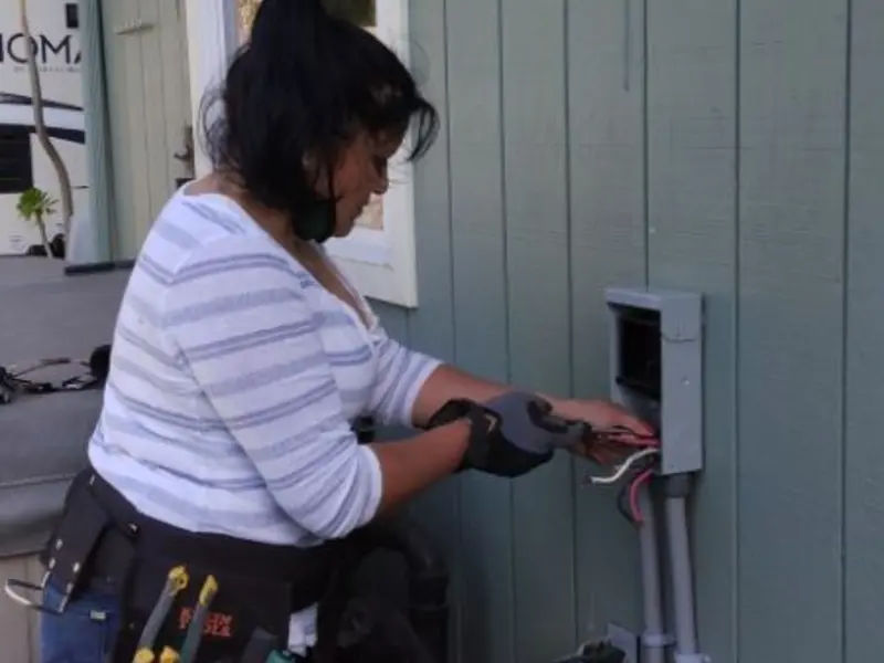 Licensed electrician wiring an exterior subpanel in Warr Acres